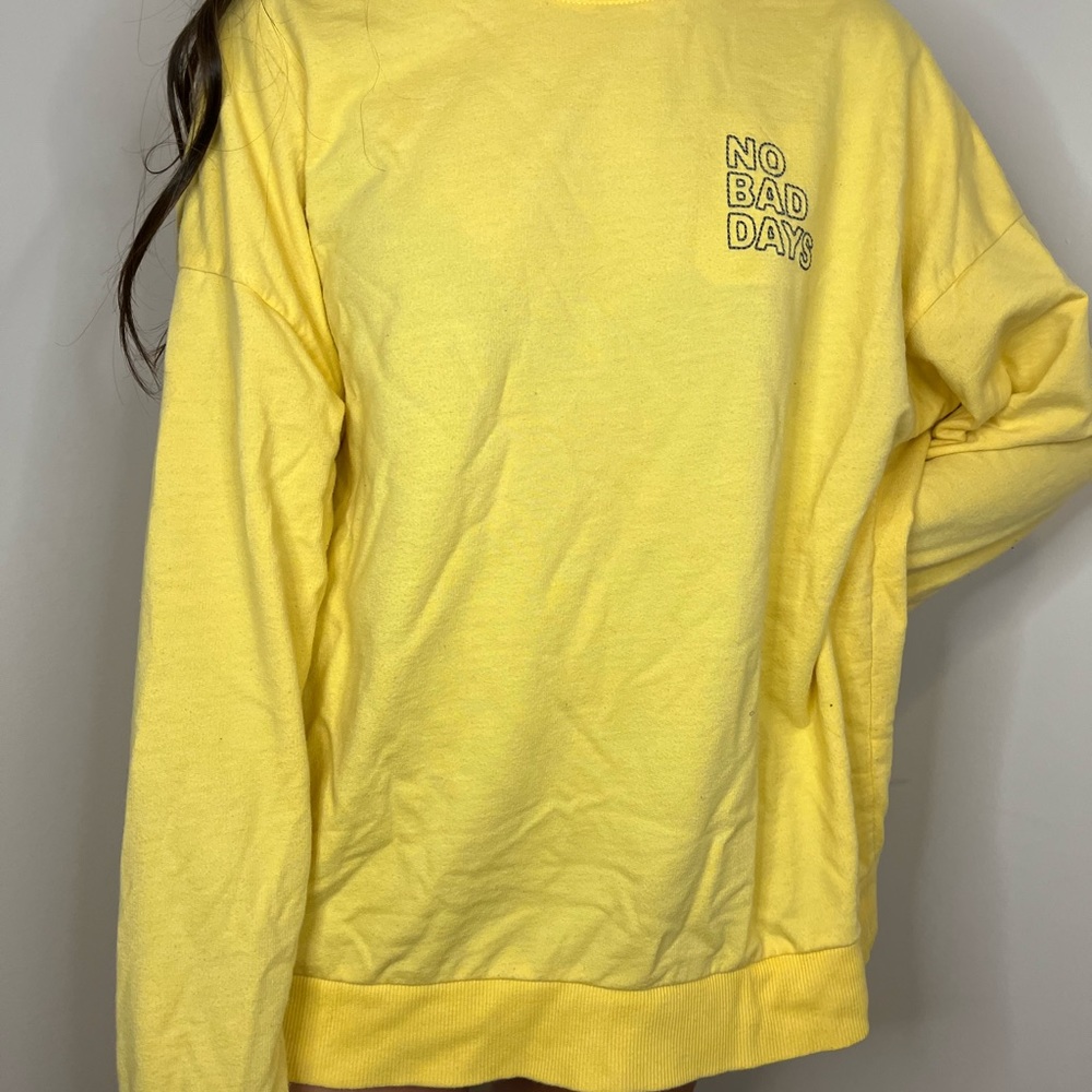 yellow long sleeve shirt